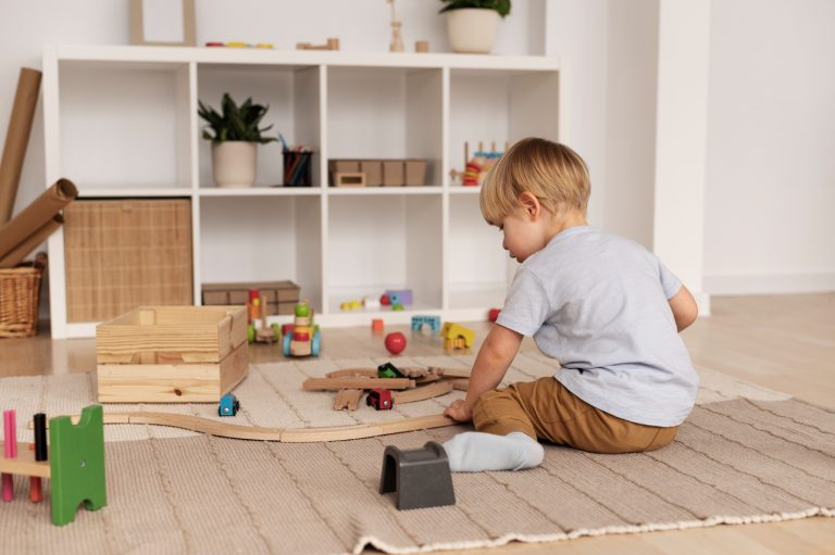 Young child independently choosing toys from a Montessori-style low shelf at home