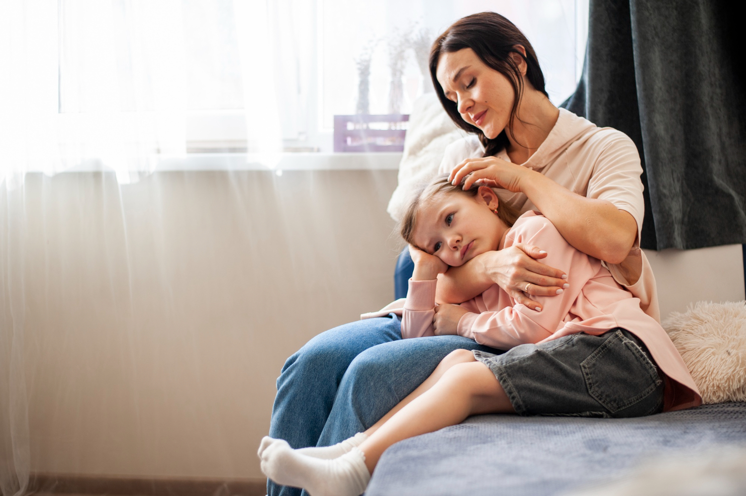 Mother hugging daughter in a candid moment, showing gentle parenting in action and answering what is parenting for modern families