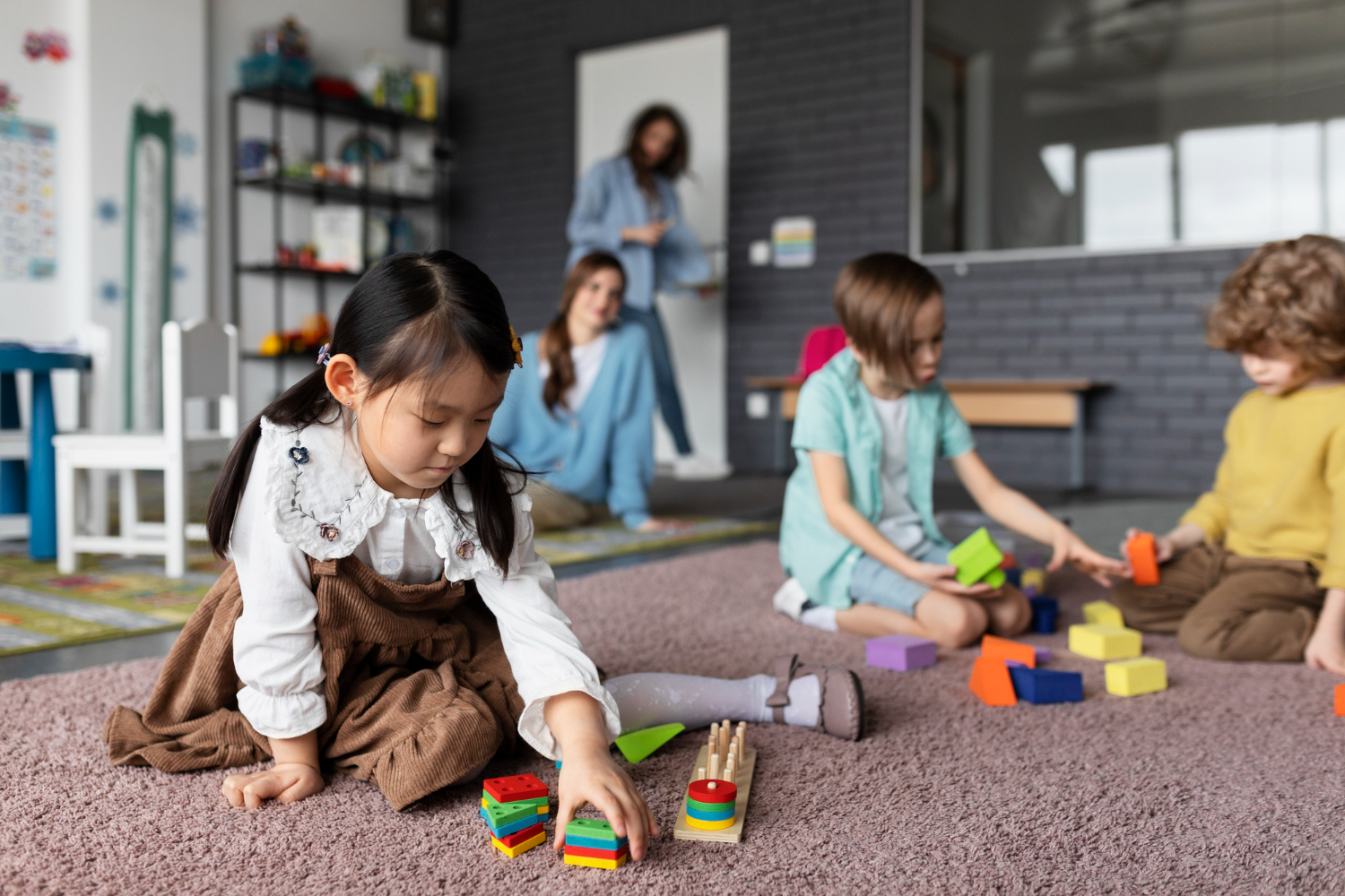 Children engaged in hands-on activities in a Montessori classroom – a practical example of what is a Montessori school.